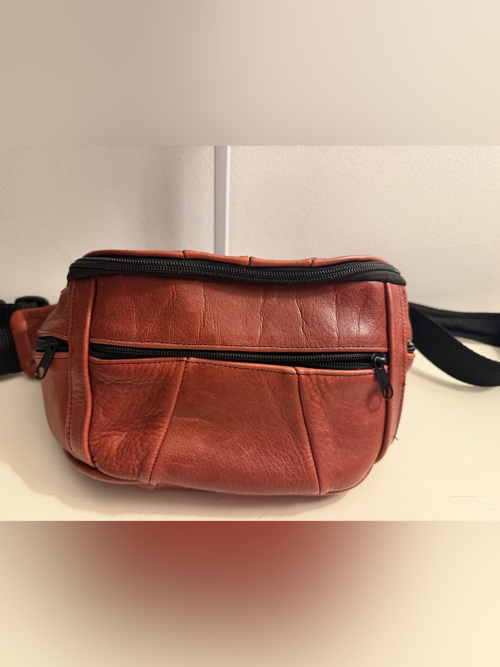 Fanny pack, reddish/brown leather, made in Mexico.